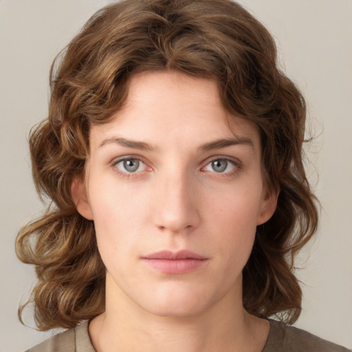 Neutral white young-adult female with medium  brown hair and green eyes