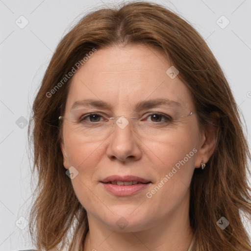 Joyful white adult female with long  brown hair and brown eyes