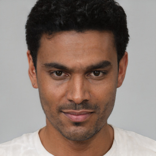 Neutral black young-adult male with short  black hair and brown eyes