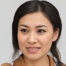 Joyful asian young-adult female with medium  brown hair and brown eyes