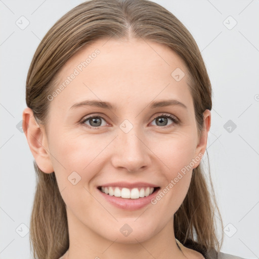 Joyful white young-adult female with long  brown hair and grey eyes