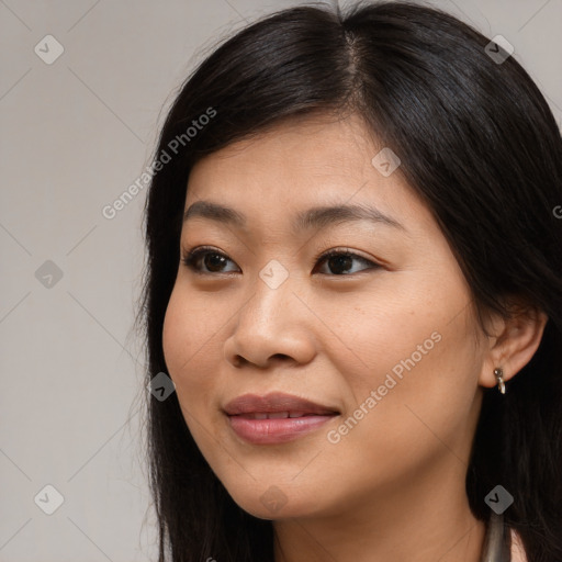 Joyful asian young-adult female with long  brown hair and brown eyes