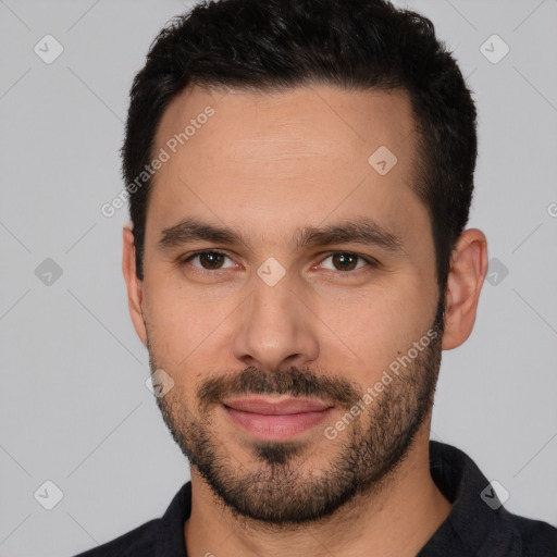 Joyful white young-adult male with short  black hair and brown eyes