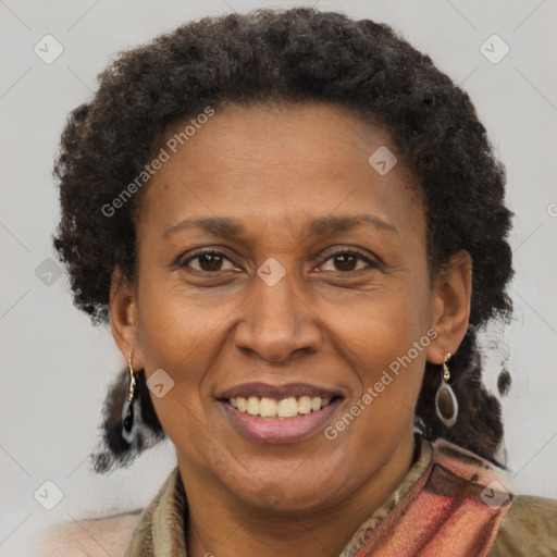 Joyful black adult female with short  brown hair and brown eyes