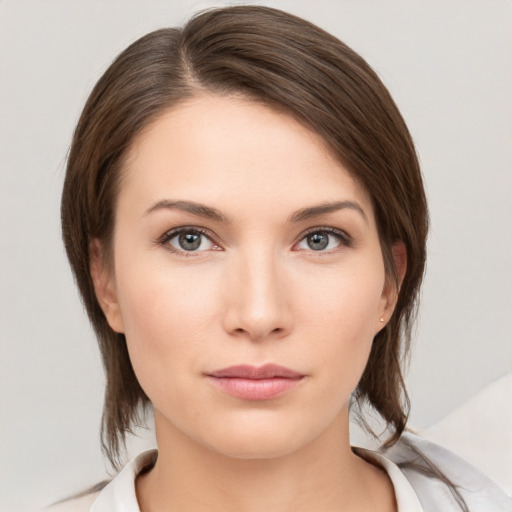 Neutral white young-adult female with medium  brown hair and brown eyes