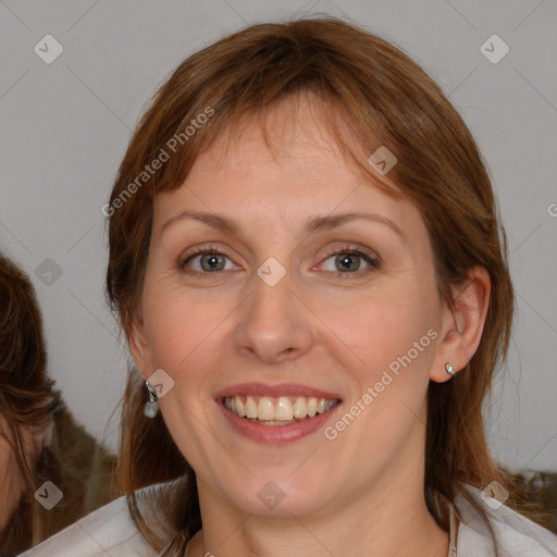 Joyful white young-adult female with medium  brown hair and blue eyes