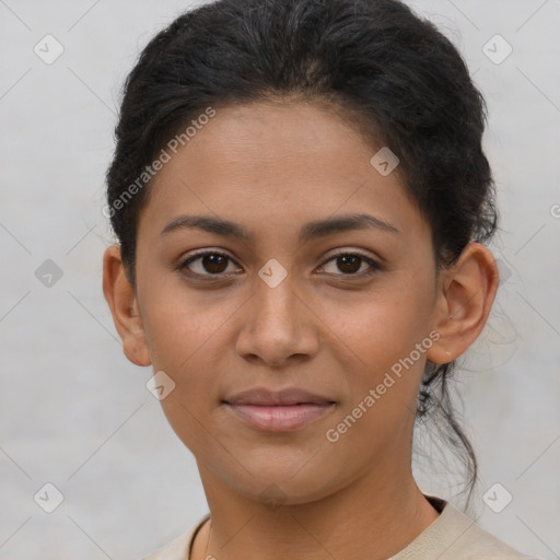 Joyful latino young-adult female with short  brown hair and brown eyes