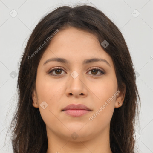 Joyful latino young-adult female with long  brown hair and brown eyes