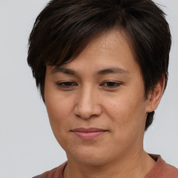 Joyful white adult female with short  brown hair and brown eyes