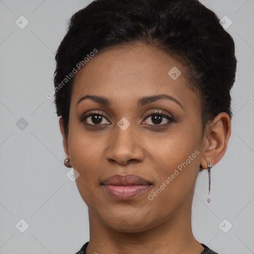 Joyful black young-adult female with short  black hair and brown eyes