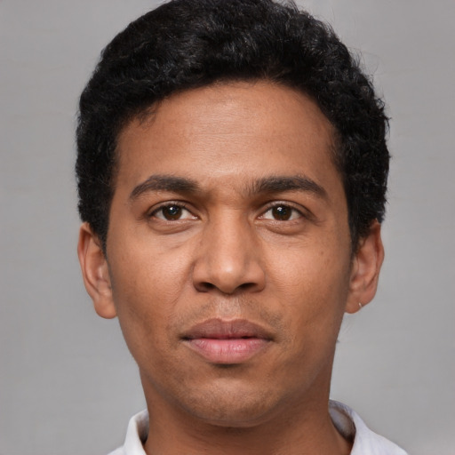 Neutral latino young-adult male with short  black hair and brown eyes