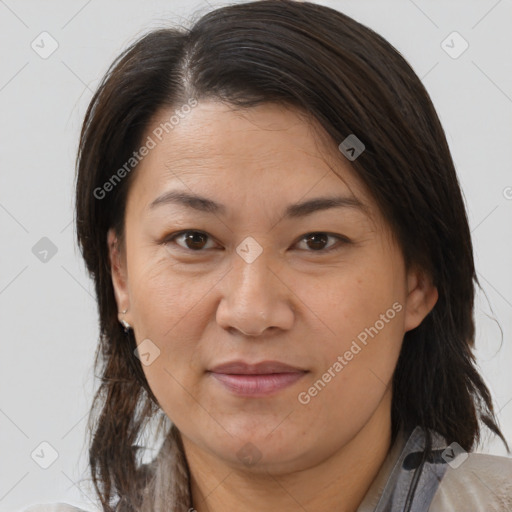 Joyful white adult female with medium  brown hair and brown eyes