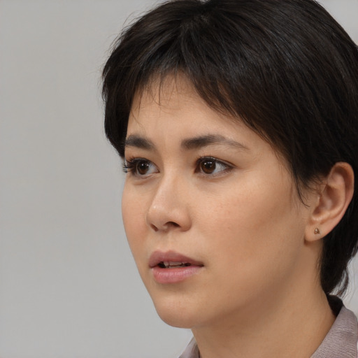 Neutral white young-adult female with medium  black hair and brown eyes