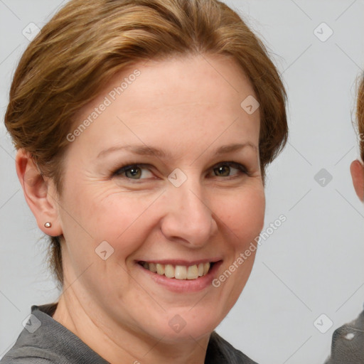 Joyful white adult female with short  brown hair and grey eyes