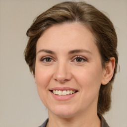 Joyful white young-adult female with medium  brown hair and brown eyes