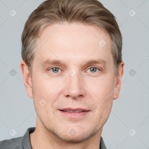 Joyful white adult male with short  brown hair and grey eyes