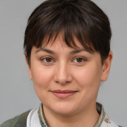 Joyful white adult female with medium  brown hair and brown eyes