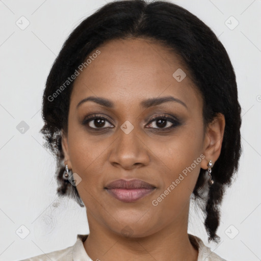 Joyful black adult female with medium  brown hair and brown eyes