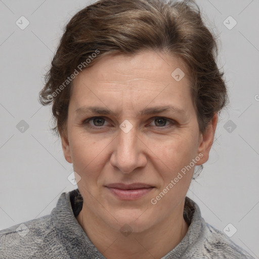 Joyful white adult female with short  brown hair and grey eyes