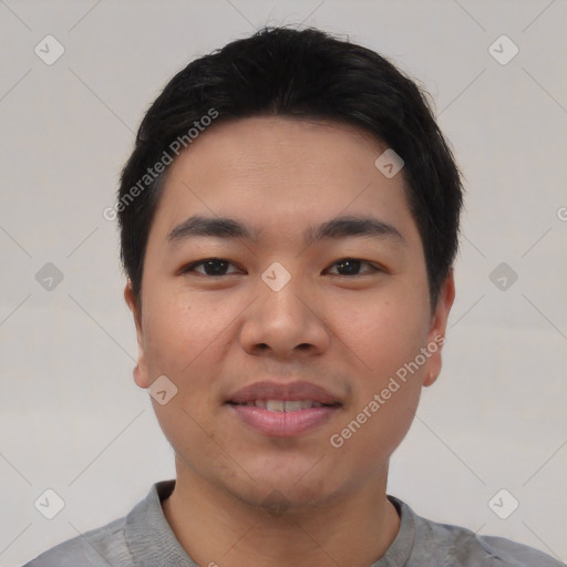 Joyful asian young-adult male with short  black hair and brown eyes