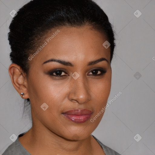 Joyful black young-adult female with short  brown hair and brown eyes