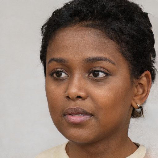 Neutral black young-adult female with short  brown hair and brown eyes