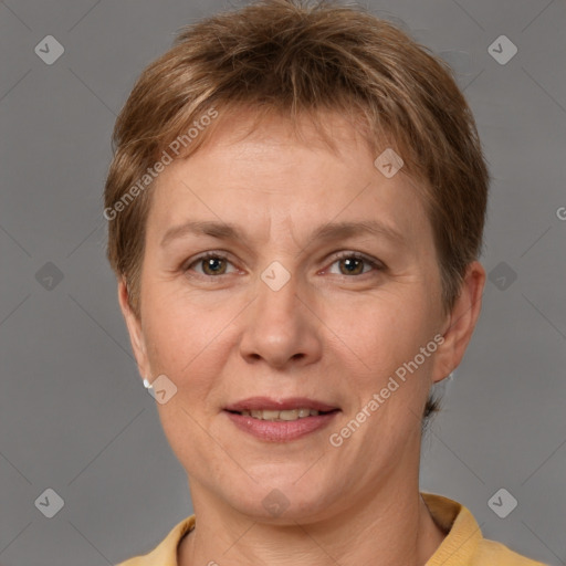 Joyful white adult female with short  brown hair and brown eyes