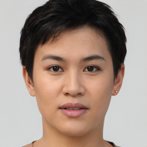 Joyful asian young-adult female with short  black hair and brown eyes