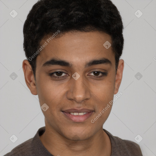 Joyful latino young-adult male with short  brown hair and brown eyes