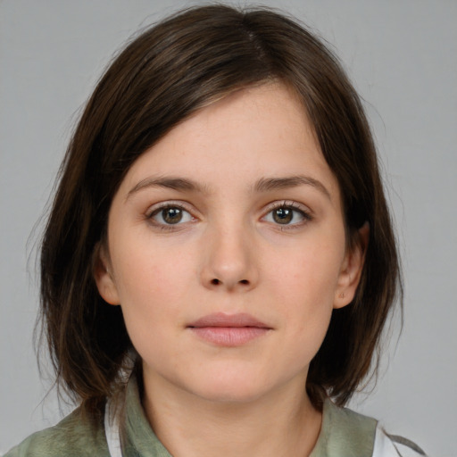 Neutral white young-adult female with medium  brown hair and brown eyes