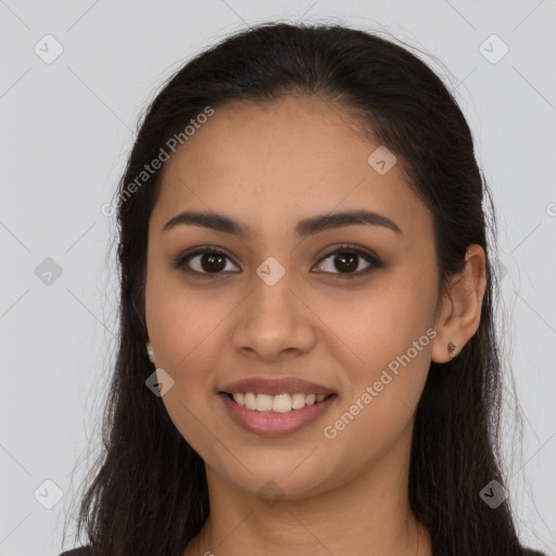 Joyful latino young-adult female with long  brown hair and brown eyes