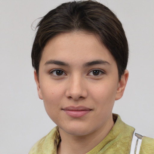 Joyful white young-adult female with medium  brown hair and brown eyes