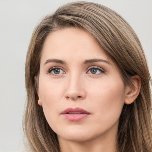 Neutral white young-adult female with long  brown hair and brown eyes