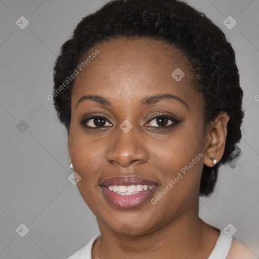 Joyful black young-adult female with short  brown hair and brown eyes