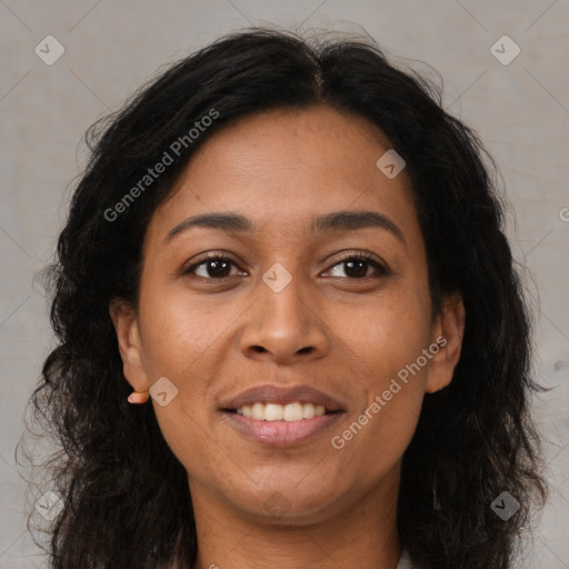 Joyful latino adult female with long  brown hair and brown eyes