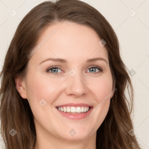 Joyful white young-adult female with long  brown hair and green eyes