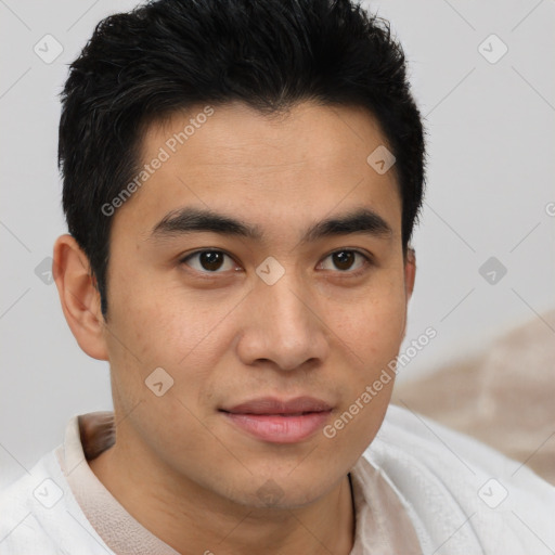 Joyful asian young-adult male with short  brown hair and brown eyes