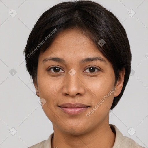 Joyful latino adult female with short  brown hair and brown eyes