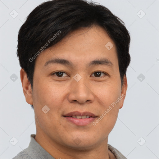 Joyful asian young-adult male with short  brown hair and brown eyes