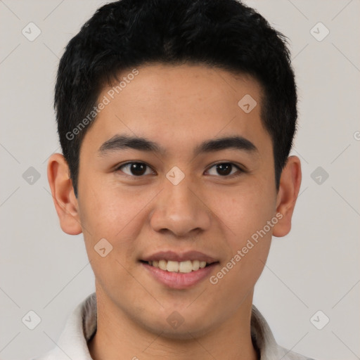 Joyful latino young-adult male with short  black hair and brown eyes