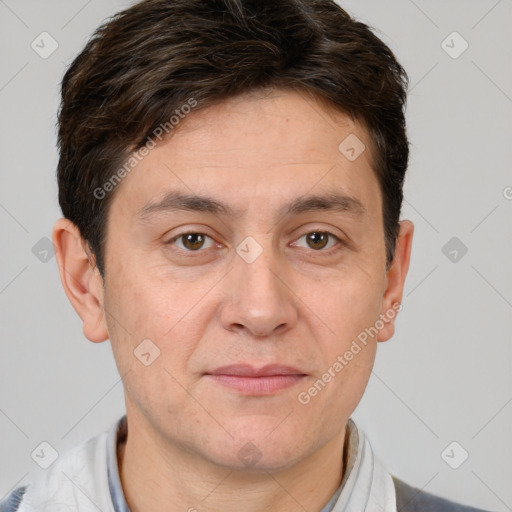 Joyful white adult male with short  brown hair and brown eyes