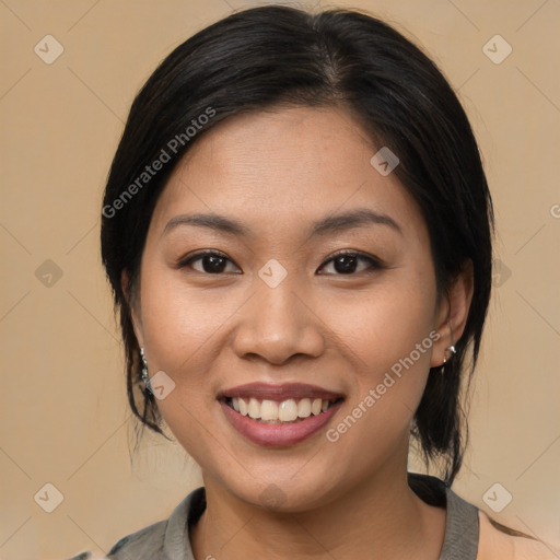 Joyful asian young-adult female with medium  brown hair and brown eyes