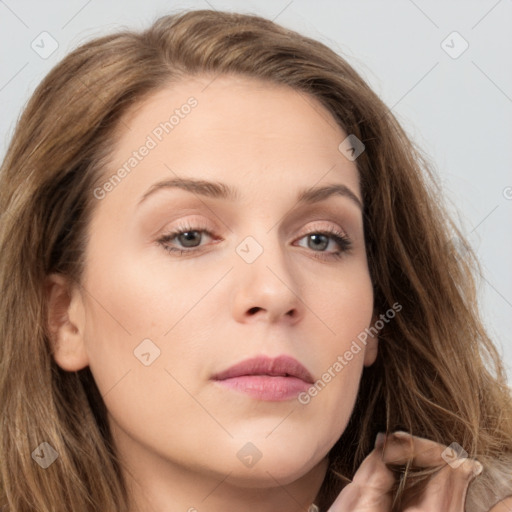 Neutral white young-adult female with long  brown hair and brown eyes