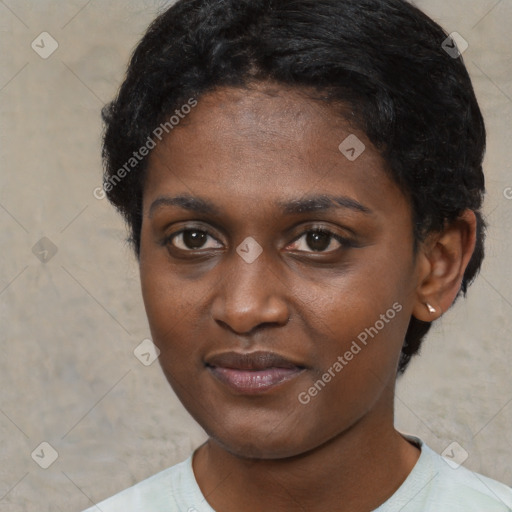 Joyful black young-adult female with short  brown hair and brown eyes