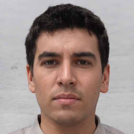 Neutral white young-adult male with short  black hair and brown eyes