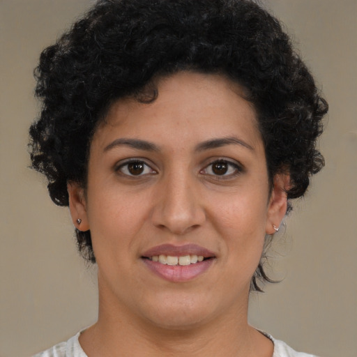 Joyful latino young-adult female with short  brown hair and brown eyes
