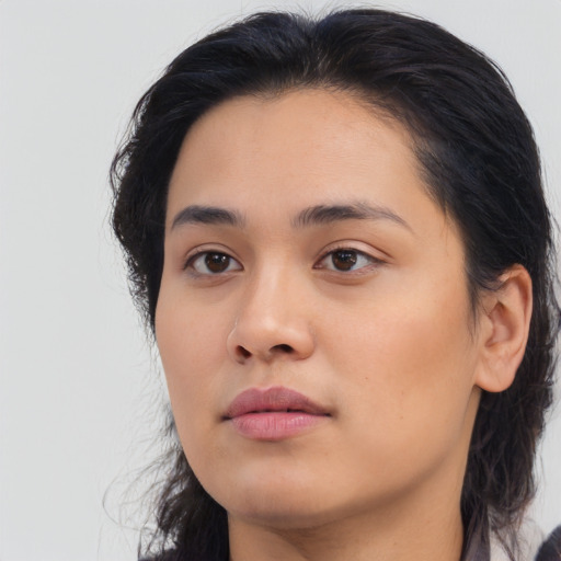 Neutral latino young-adult female with medium  brown hair and brown eyes