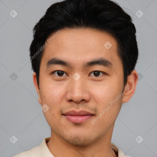 Joyful asian young-adult male with short  black hair and brown eyes