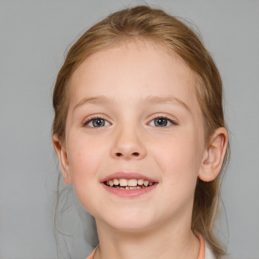 Joyful white child female with medium  brown hair and blue eyes