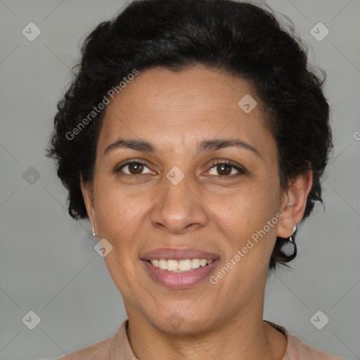 Joyful latino adult female with short  brown hair and brown eyes